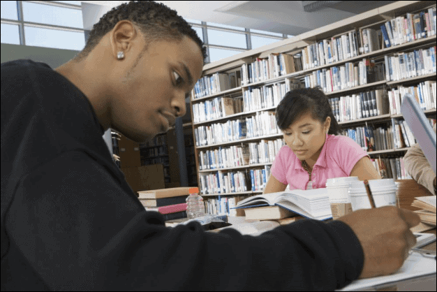 Two Students Studying in a School Library.