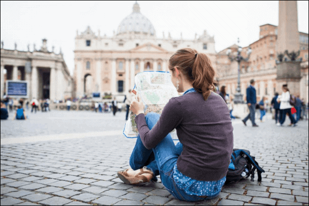 Young Woman Tourist Studying a Map.