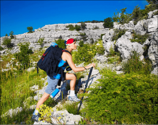 Female Backpacker on a Mountain.