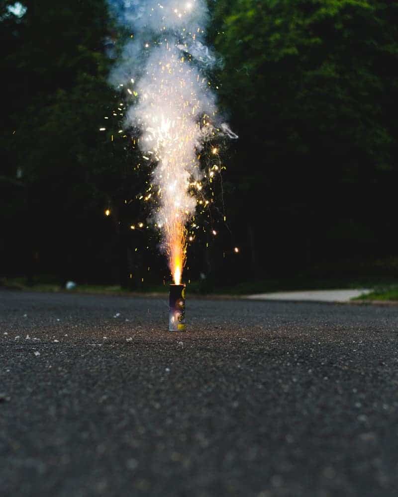 A novelty fountain firework exploding on the ground.