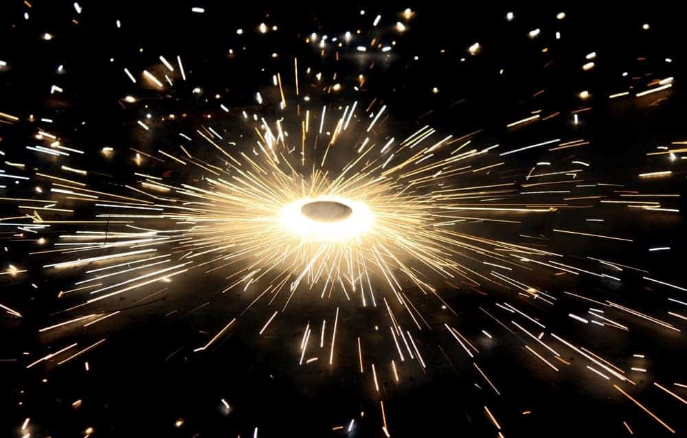 A ground spinner splashing sparks around it in a circular pattern.