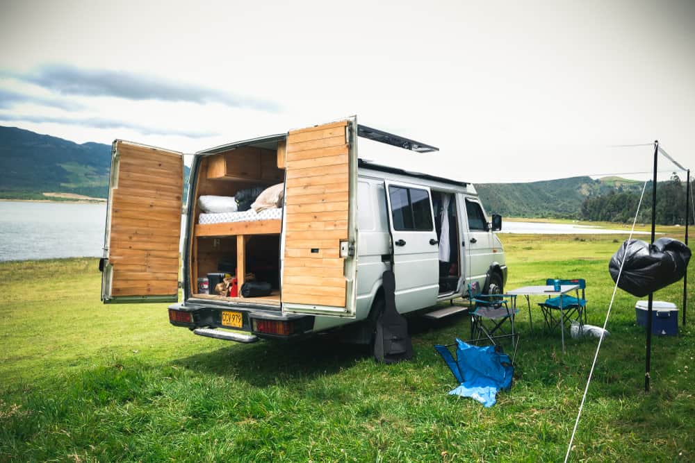 Camper van parked next to Neusa Reservoir.